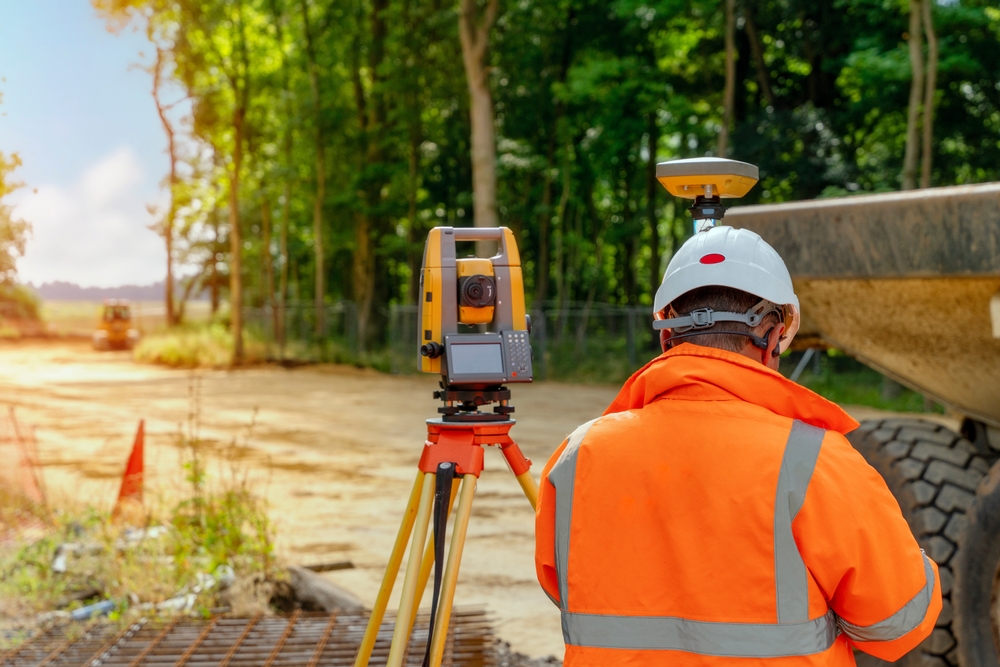Surveyor,Site,Engineer,With,Total,Positioning,Station,On,The,Construction